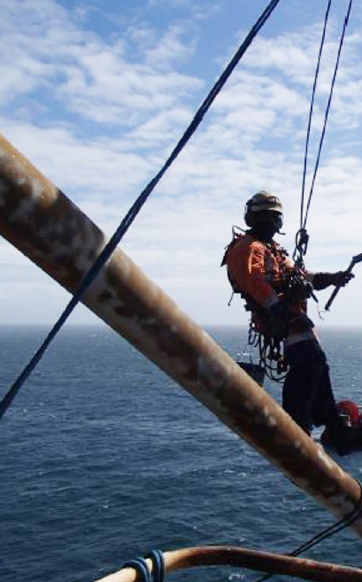 Image of rope access blasting and painting offshore for InterGroup's tank cleaning services and marine maintenance services in and around New Zealand, nationwide.